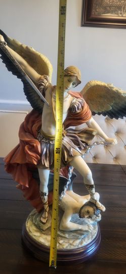 Archangel Michael stepping on enemy's head