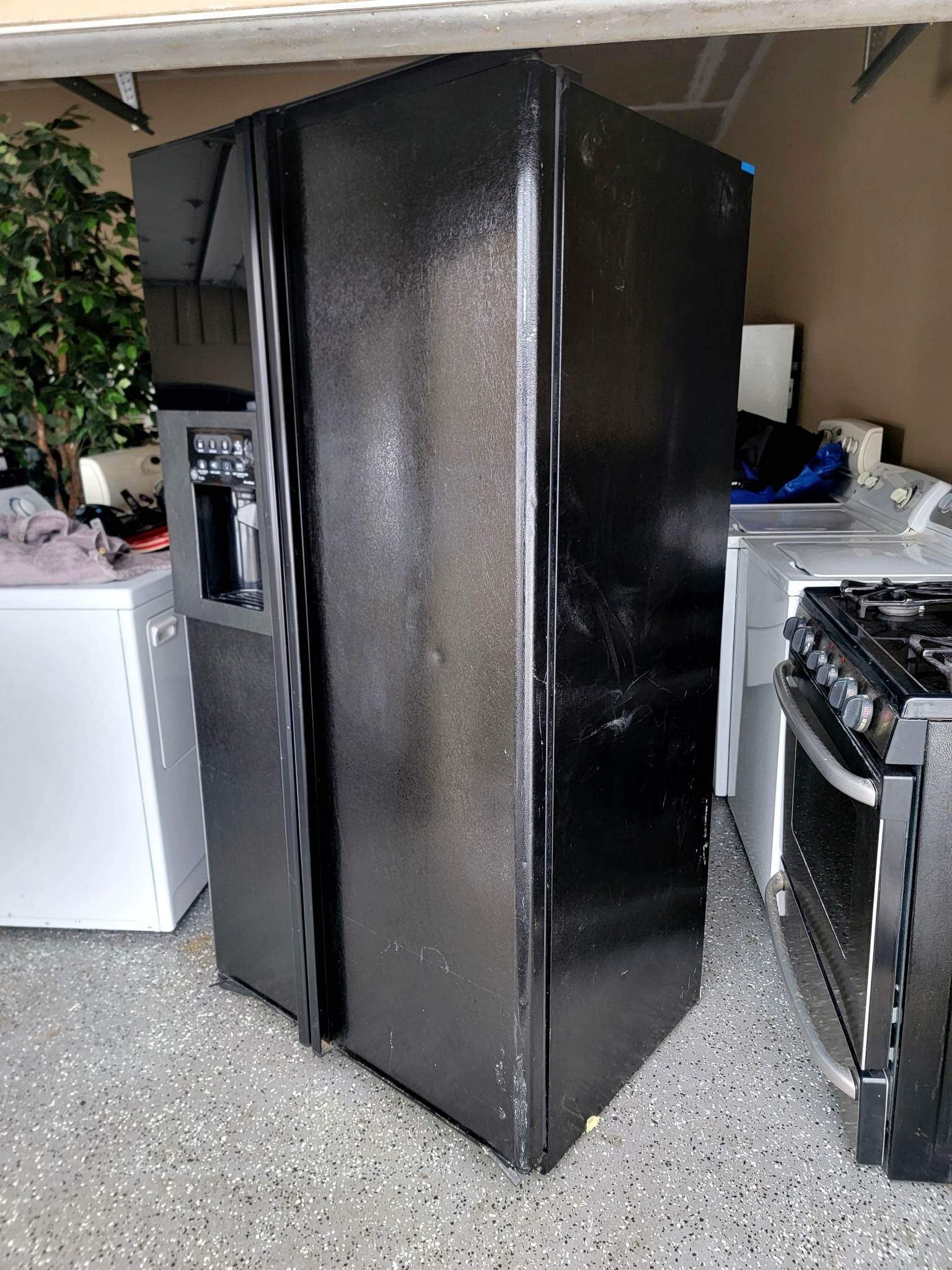 GE Side-by-side black side-by-side refrigerator in excellent