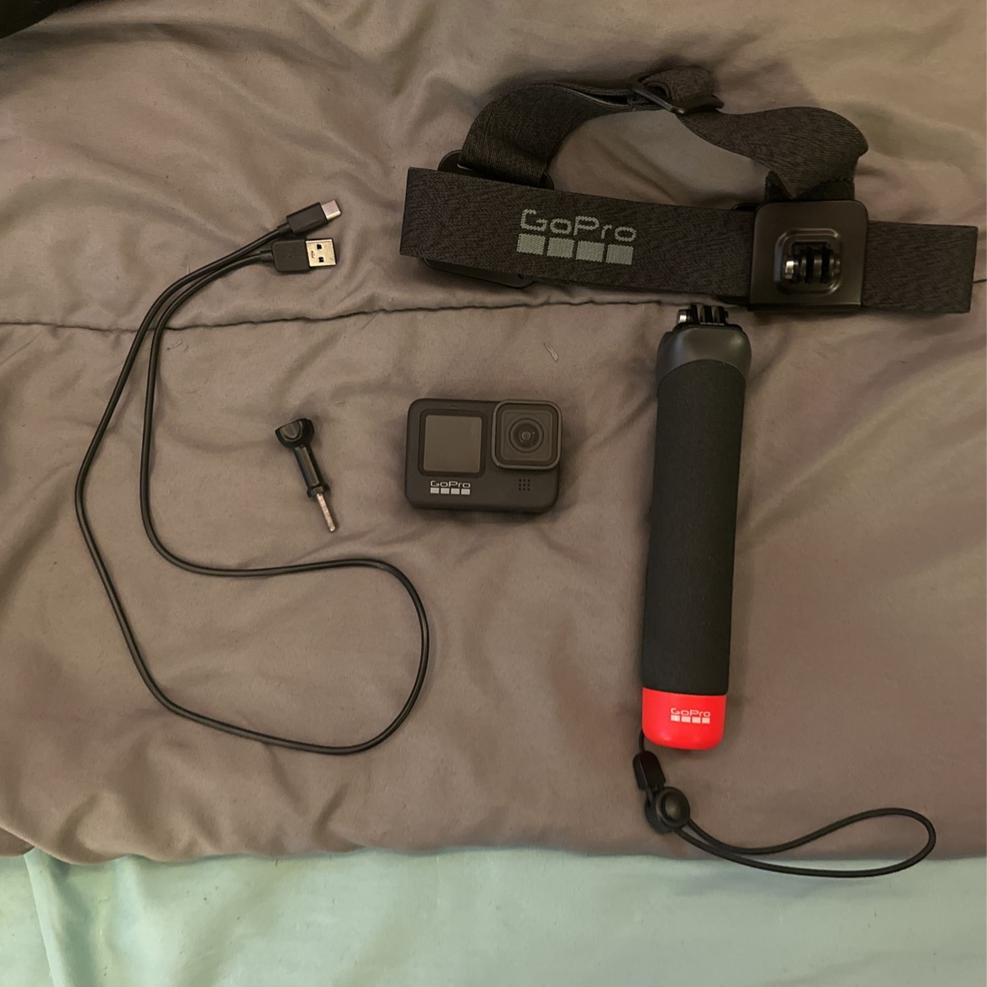 GoPro HERO 9 with head strap and hand grip