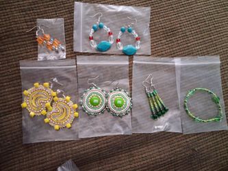 2 medallion earrings and 1 bracelet and 3 other earings