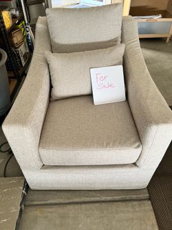 Slip covered swivel chair