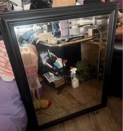 Approx 26x37 large  black mirror a hole on each corner as it was drilled straight on the wall. Cool mirror design . Located off lake mead and Simmons 