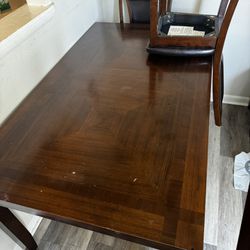 dining room table with 4 chairs and a bench