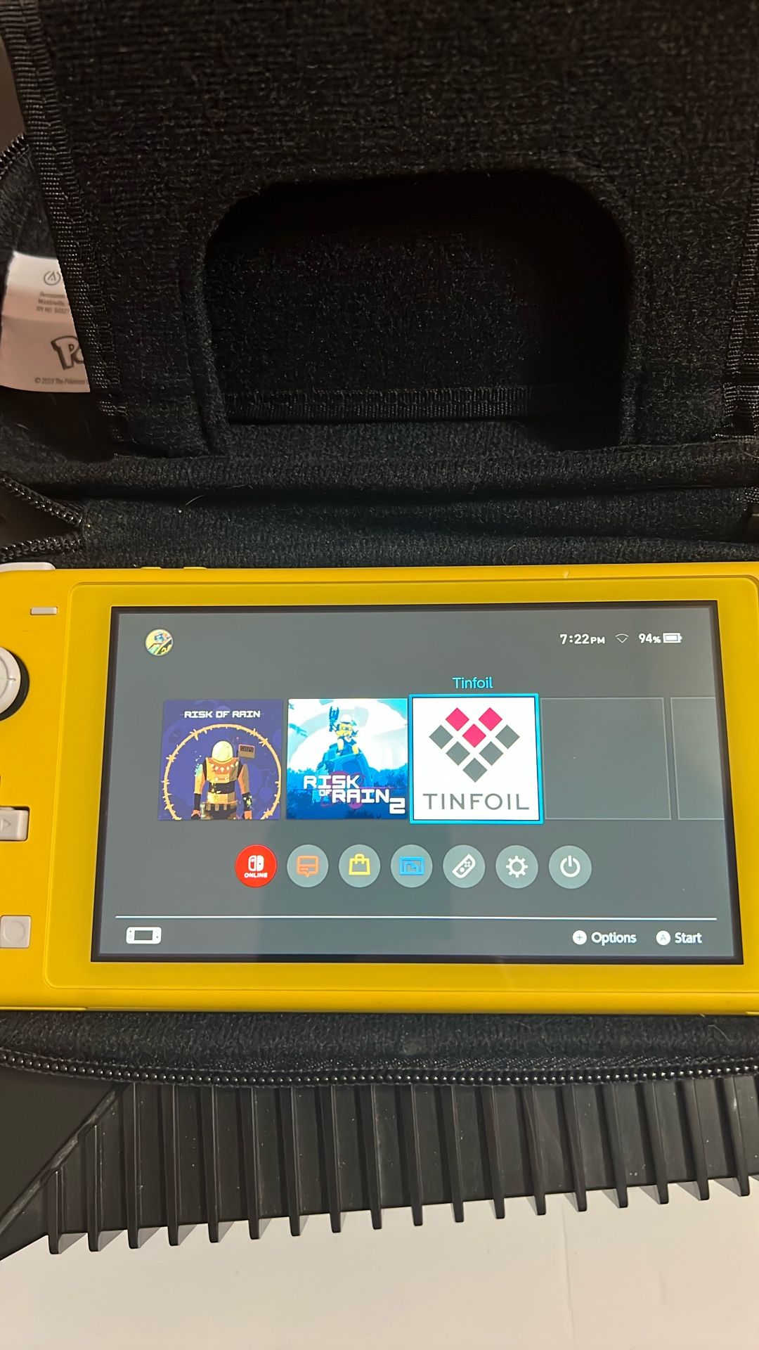 Yellow Nintendo Switch Lite with case
