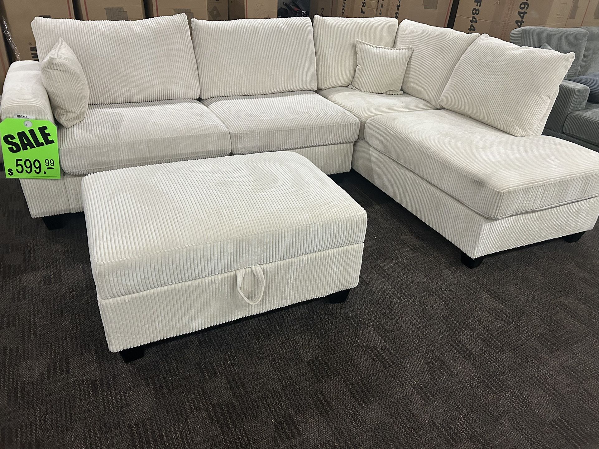 Cream Sectional W/ Storage Ottoman. 