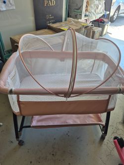 Pretty pink baby bassinet, brand new and assembled