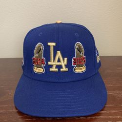 New Era LA Dodgers Gold 24 25 World Series Champions Size 7 3/4. Good Condition.
