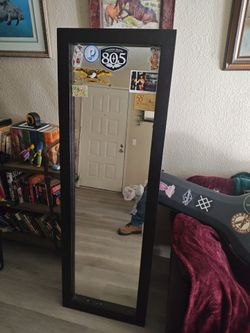 Dark wood framed full length mirror