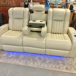 Like New Leather Electric Dual Reclining Couch With Electric Headrests And Dual USB And Wireless Charging Stations And LED Lighting 