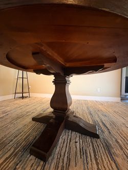 Round Wooden Pedestal Dining Table