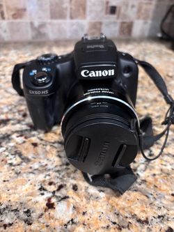 Canon full HD50X with battery charger  and case Camera