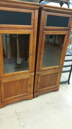 Two glass front cabinets with glass shelves