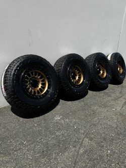 FINANCING AVAILABLE KMC KM552 IMS 6x5.5 17" Wheels Bronze With 33” Falken WildPeak AT4W All-Terrain Tires