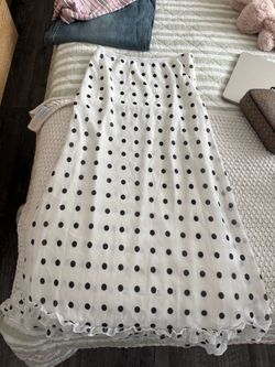 White & black sheer polka dot midi skirt with ruffled detailing and side zipper