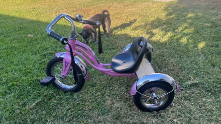 Pink schwinn tricycle