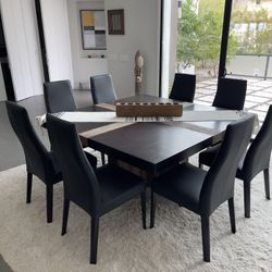 Dining table w/ 8 leather chairs