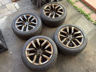 Nissan 370Z OEM Aluminum 18” wheels and Continental DWS06+ tires (staggered).