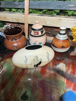 This lot of 4 hand-painted Southwestern art pottery vases is a beautiful representation of Mexican