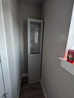 Tall Light Gray Glass-Door Storage Cabinet