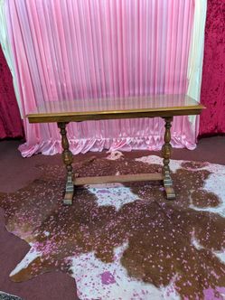 Antique walnut trestle table measuring approx. 54" long x 30 1/4" tall x 20" front to back.