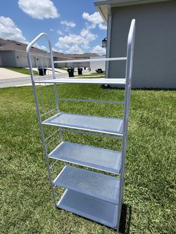 Selling a white metal shelving unit with 5 shelves