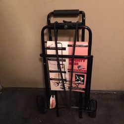 BRAND NEW NEVER USED MIGHTY MINI HAND CART WITH TWO STRETCH CORDS LITE WEIGHT AND STURDY FOLDS UP EASY $20.00