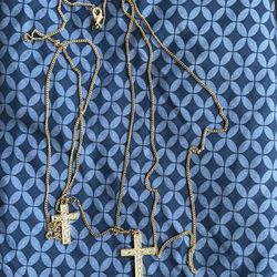 Long gold tone chain with two delicate crosses