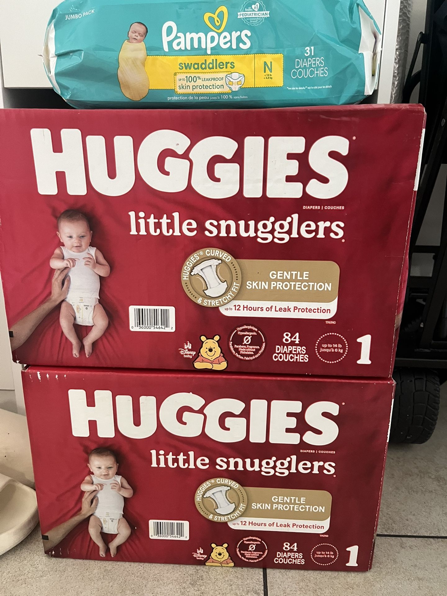 Brand NEW 2 Boxes Of Huggies Diaper Plus Pampers NB Free