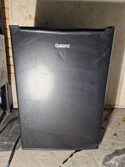Galanz compact mini refrigerator in black.     It typically features a capacity between 2.7 and 3.3 cubic feet.