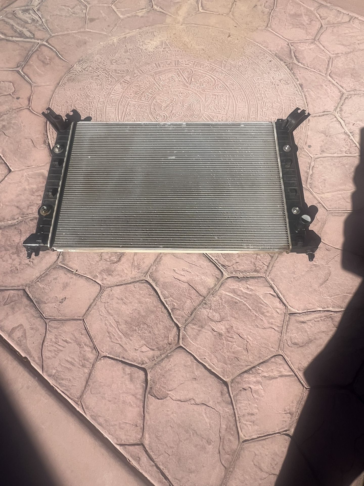 I have this radiator for a 2013 Chevy Silverado. It's used and new, and costs $415 + tax. I'm asking $175 for it. It's semi-new.