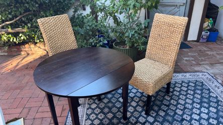 Four woven dining chairs