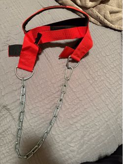 Red weightlifting neck harness with chain