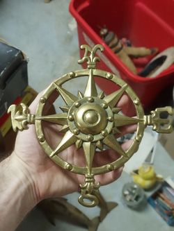 Vintage brass nautical compass wall hanging.