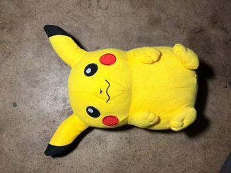 yellow Pokémon Pikachu plush toy with black-tipped ears