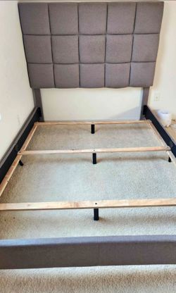 Queen bed frame with upholstered headboard