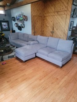2 PC Sectional Grey In Color. Soft. No Damage Or Smoking