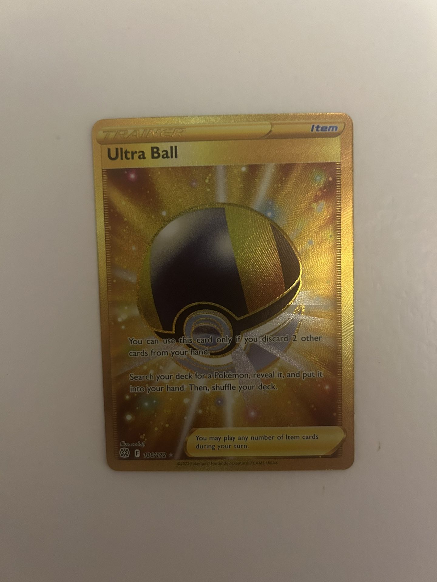 Pokémon Ultra Ball Trainer 186/172 Gold Rare
