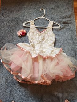White and Pink Ballet costumes size 14 in great condition. And hair piece.