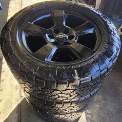 Clean set of 20 inch black LTZ rims with Toyo Open Country A/T tires. All matching 33x12.5R20 LT tires. Has 6 lugs. Fits Chevy Silverado, Tahoe, Subur