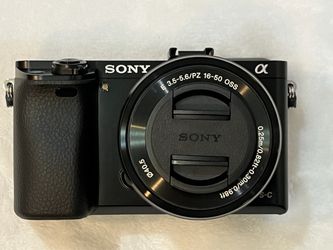 Sony a6000 Mirrorless Camera + 16-50mm OSS Lens + Exras