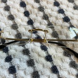 Cartier Gold and Black Rimless Eyewear