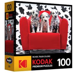 KODAK 3 Dalmatian  puppies sitting on a bright red couch 100 puzzle piece.