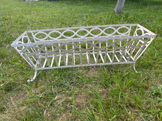 Iron planter ….over the rail or can set on ground