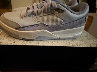 Jordan 4 RM. Gray Low-Top Sneakers with Suede Detail.Size 7 women