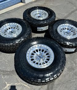 Brand New KMC IMS 17x8.5 Wheels and 35/12R17 TOYO Open Country AT3 Tires 6x139 -10 Offset