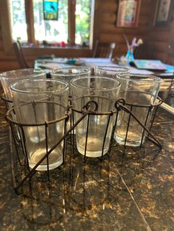 Drinking glasses in metal carrier