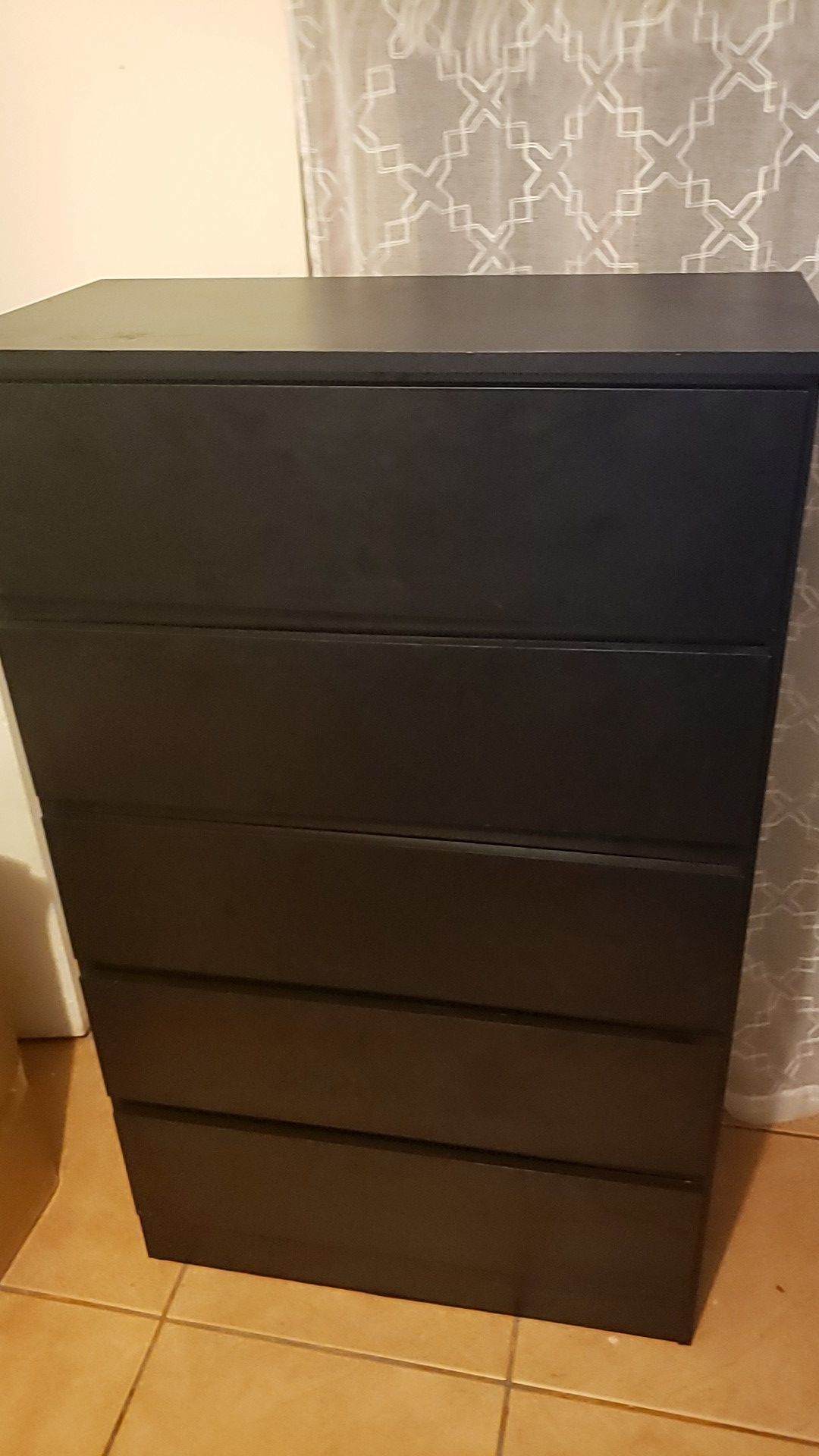 Tall black dresser