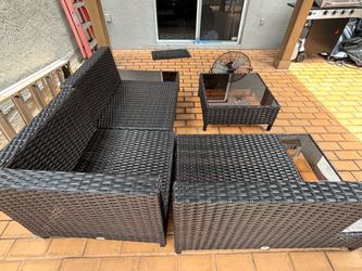 Outdoor patio couch and glass table