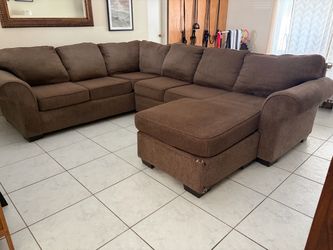Brown sectional couch with chaise