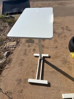 Adjustable height over-bed table